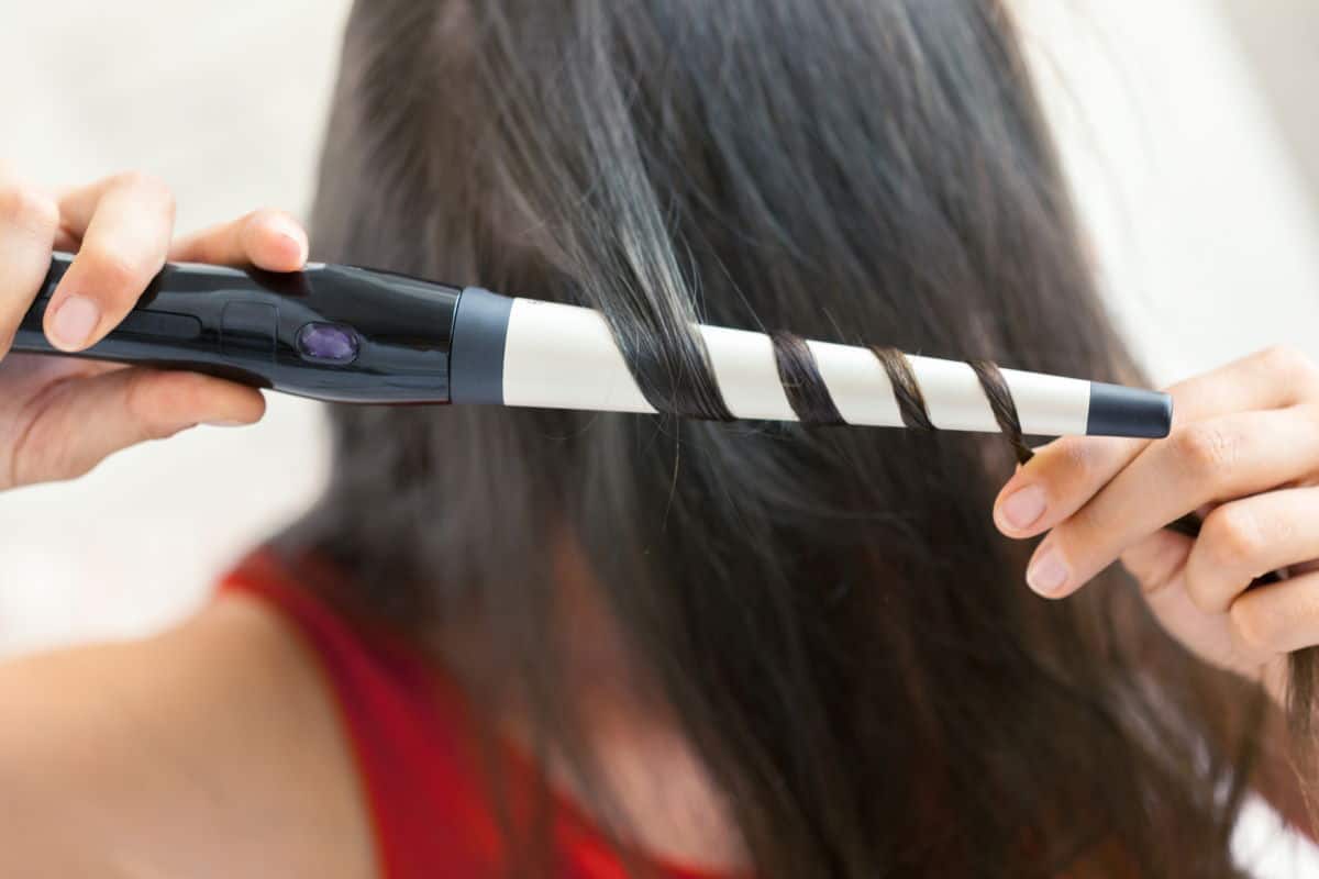 hair wrapped around curling wand