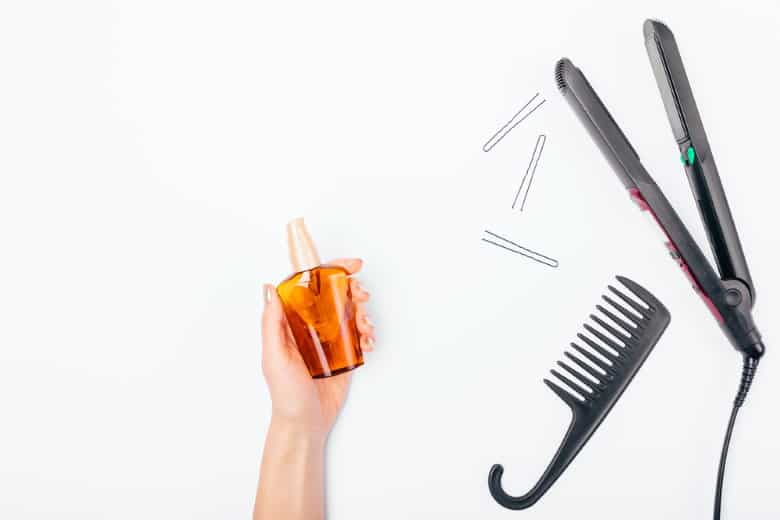 hair oil with flat iron and comb
