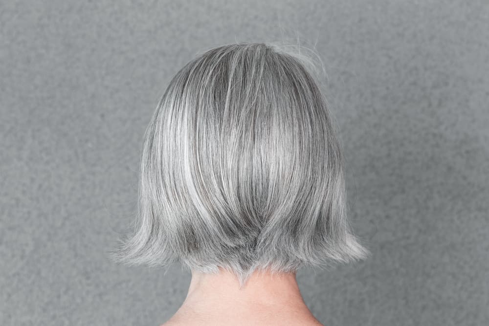 back view of woman with short gray bob haircut