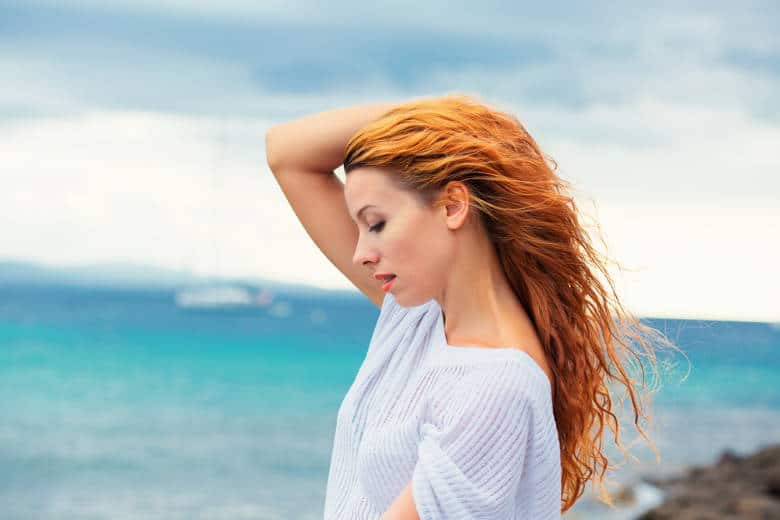 woman with long red beach waves